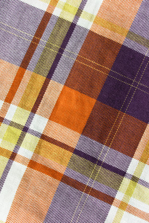 Yellow tartan cloth as a background