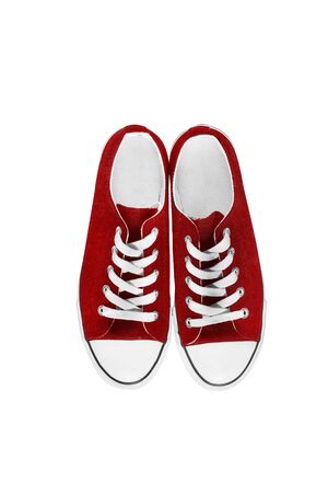 Red traditional gumshoes isolated over whiteの写真素材