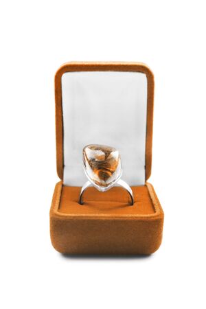 Amber ring in a jewel box on white backgroundの写真素材