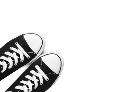 Black sneakers on white as a backgroundの写真素材