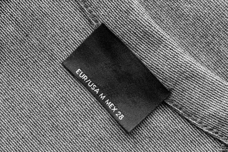 Blank black clothes label as a background