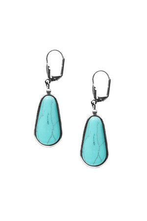 Beautiful turquoise earrings on white backgroundの写真素材
