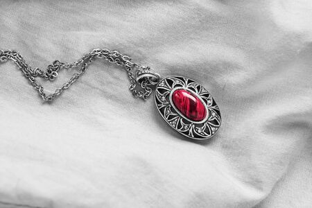 Coral vintage medallion on blank white clothの写真素材