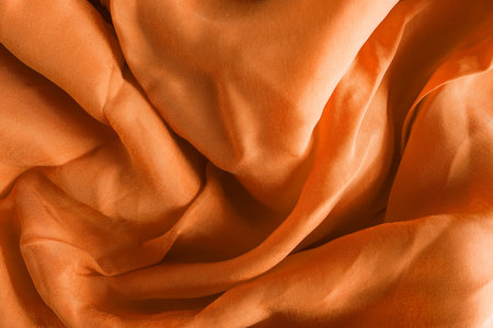 Golden draped silk as a backgroundの写真素材