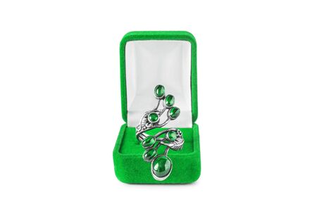 Beautiful emerald ring in jewel box on white backgroundの写真素材