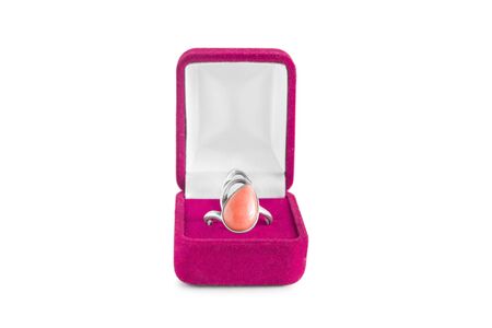 Silver coral ring in pink box isolated over whiteの写真素材