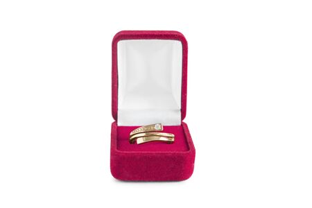 Golden ring in a jewel box on white backgroundの写真素材