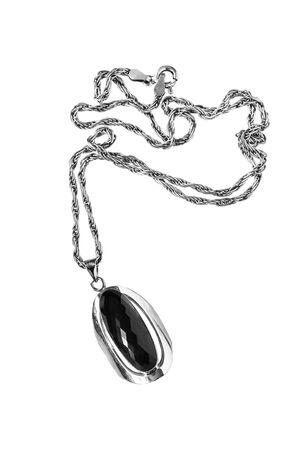 Black onyx pendant on white backgroundの写真素材