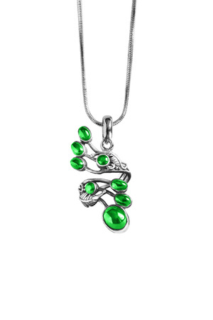 Beautiful emerald pendant on a chain isolated over whiteの写真素材