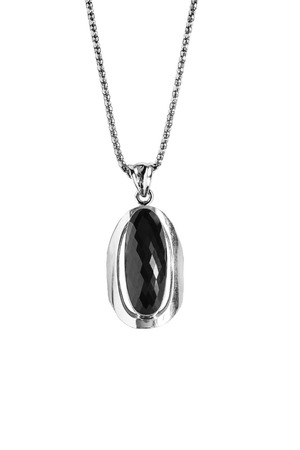 Black onyx pendant on a chain isolated over whiteの写真素材