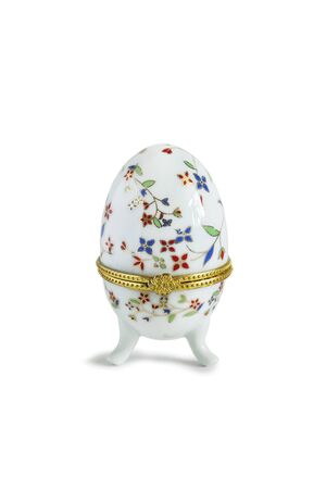 Enamelled box in the shape of an egg isolated over whiteの写真素材