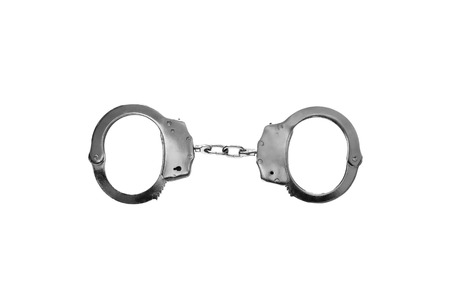 Steel police handcuffs isolated over whiteの写真素材