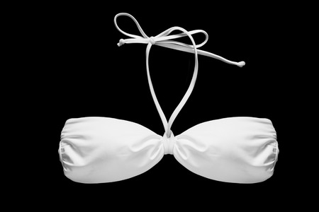 White bikini top on black backgroundの写真素材