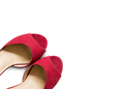 Pair of red shoes on white backgroundの写真素材