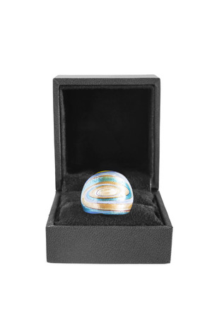 Enamelled ring in black jewel box on white backgroundの写真素材