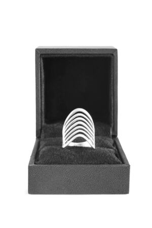Silver ring in black jewel box isolated over whiteの写真素材