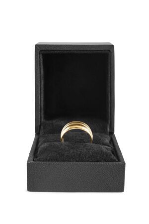 Traditional golden ring in jewel box isolated over whiteの写真素材