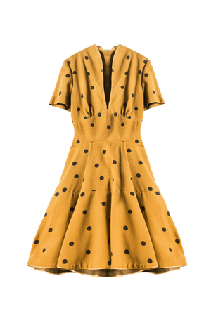 Yellow retro dress with polka dots on white backgroundの写真素材