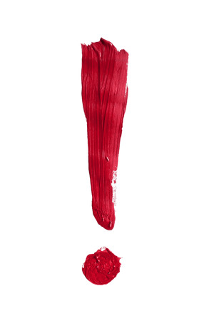 Red painted exclamation mark on white backgroundの写真素材