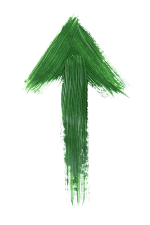 Painted green up arrow on white backgroundの写真素材