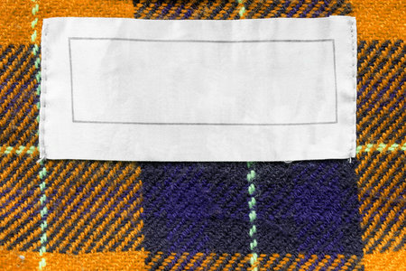 Blank white label on yellow plaid as a background