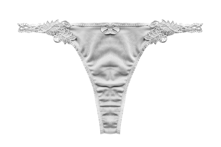 White silky thongs panties on white backgroundの写真素材