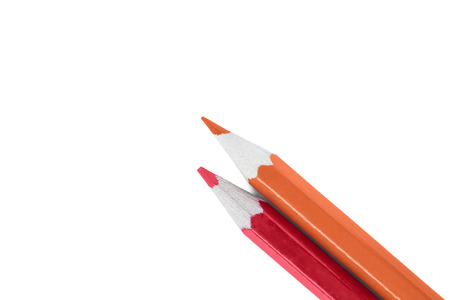 Red and orange pencils isolated over whiteの写真素材