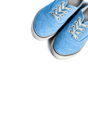 Pair of blue sneakers isolated over whiteの写真素材
