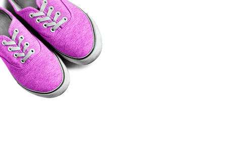 Pair of pink gumshoes on white backgroundの写真素材