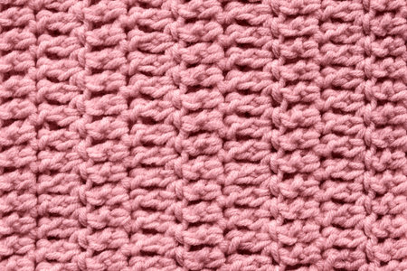 Pink knitted texture closeup as a background