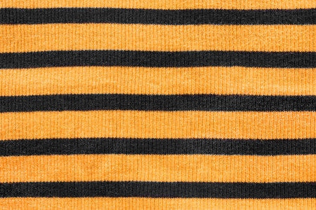 Black and yellow striped cloth as a backgroundの写真素材