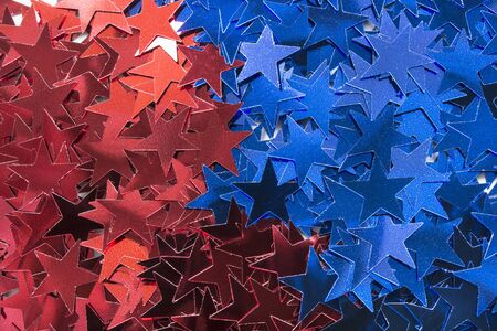 Blue and red metallic stars as a backgroundの写真素材