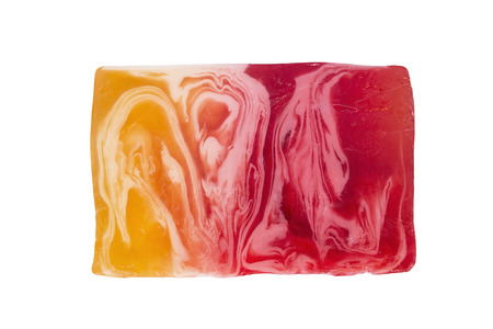 Bar of natural fruit soap on white backgroundの写真素材