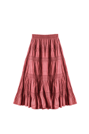 Red ethnic embroidered skirt on white backgroundの写真素材