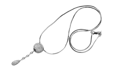 Diamond pendant on silver chain on white backgroundの写真素材