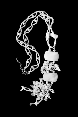 White pearl necklace on black backgroundの写真素材