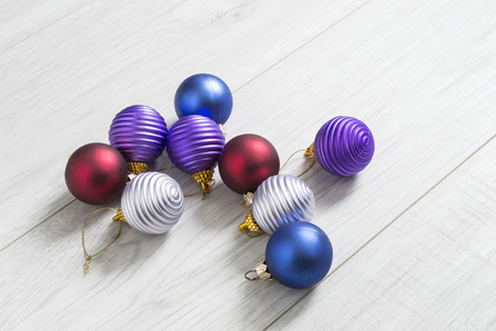 Group of colorful christmas balls on wooden backgroundの写真素材