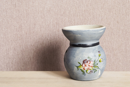 Blue ceramic candlestick on a table closeupの写真素材