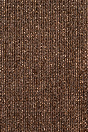 Brown with golden thread knitted texture closeupの写真素材