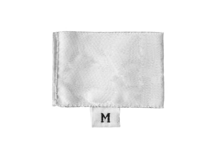 Blank white clothes label isolated over whiteの写真素材