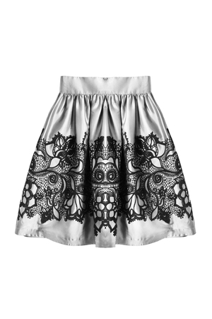 White satin skirt with black lace isolated over whiteの写真素材