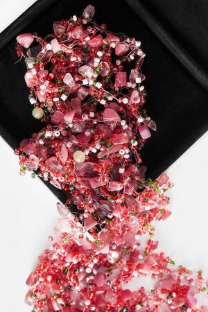 Pink glass beads in velvet jewel box closeupの写真素材