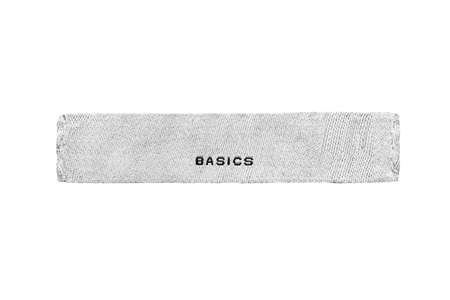 White clothes label lettered basics isolated over whiteの写真素材