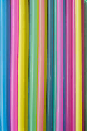 Colorful plastic cocktail sticks closeup as a backgroundの写真素材