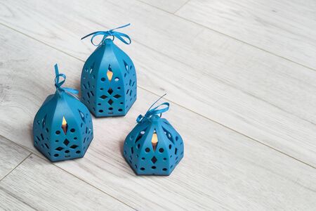 Group of blue decorative lamps on wooden backgroundの写真素材