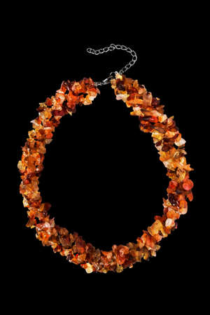 Beautiful amber necklace on black backgroundの写真素材