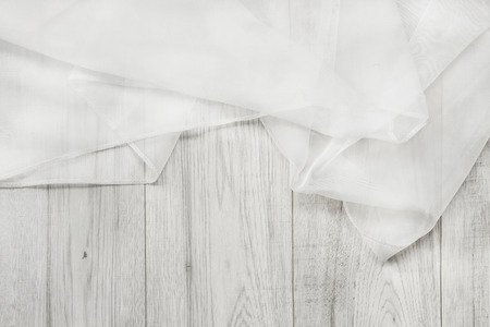 White folded chiffon on white wooden backgroundの写真素材