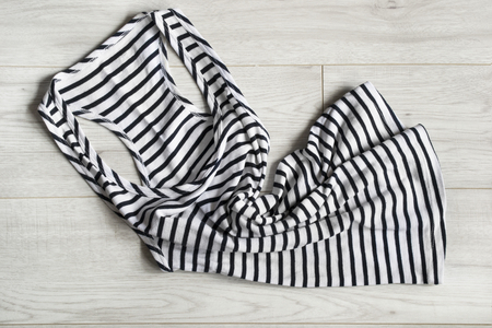 Black and white sailor tank top on wooden backgroundの写真素材