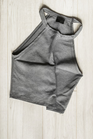 Gray crumpled crop top on wooden background closeupの写真素材