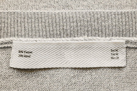 Fabric composition label on knitted cloth as a backgroundの写真素材